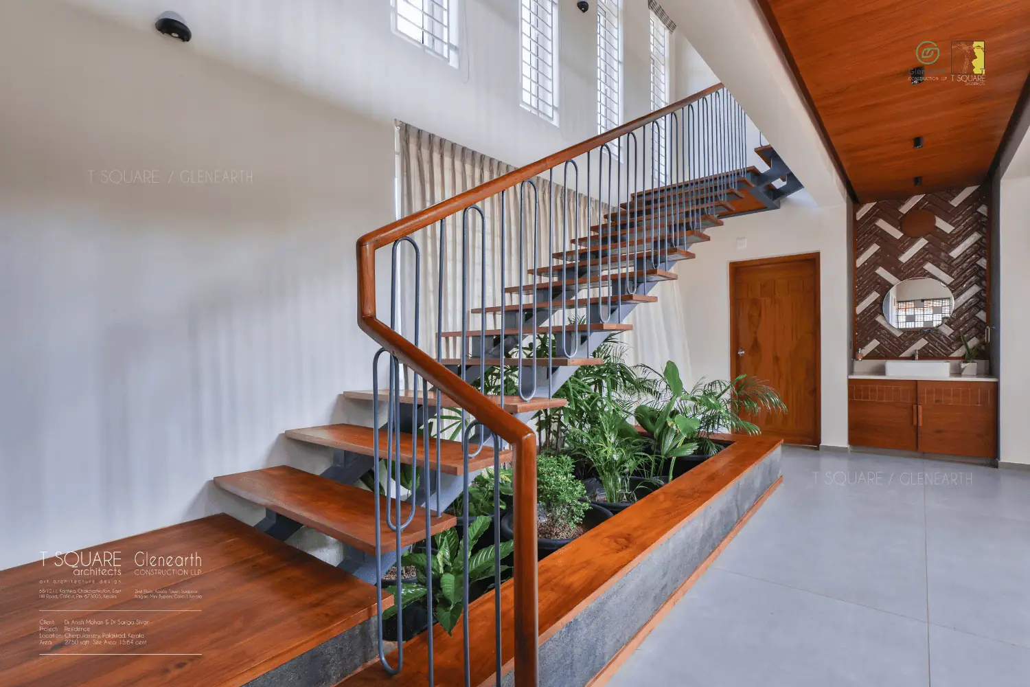 A contemporary staircase design showcasing a beautiful plant at its center, blending nature with modern aesthetics seamlessly.